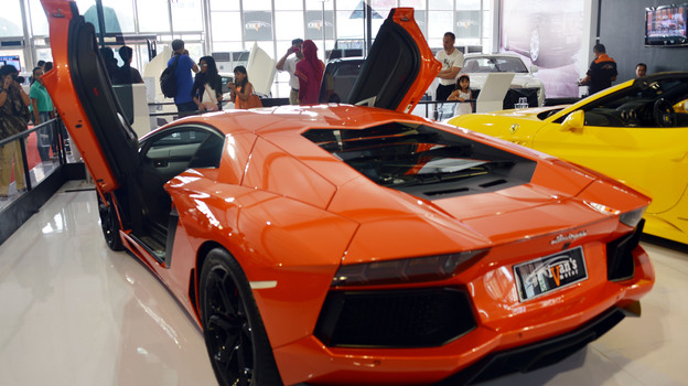 The Italian-built Lamborghini Aventador costs nearly $400,000. The money spent on election 2012 — for TV ads and other things — could theoretically get you more than 15,000 of these V12 cars. But that's a lot more than have been built.