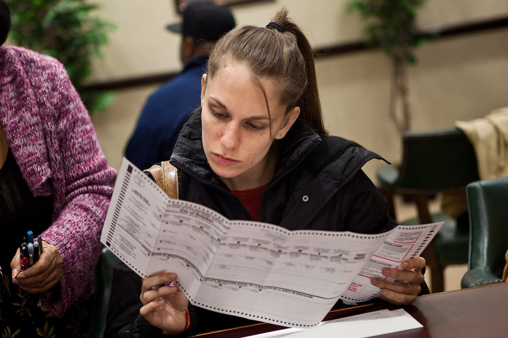 A voter fills out a ballot Sunday in Jersey City, New Jersey. Gov. Chris Christie ordered early-voting stations to stay open through the weekend.