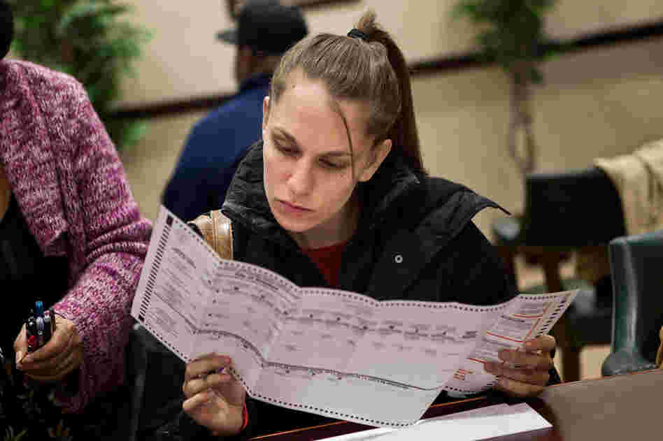 A voter fills out a ballot Sunday in Jersey City, New Jersey. Gov. Chris Christie ordered early-voting stations to stay open through the weekend.