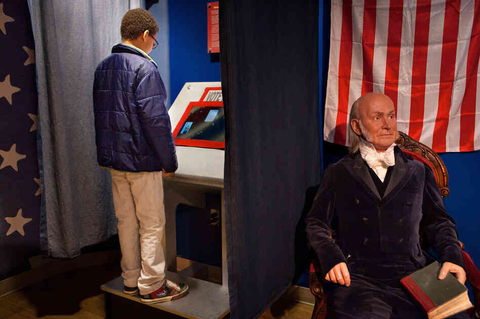 Noah Hope, 10, votes for the next president of the United States during the children's mock presidential election at Madame Tussaud Wax Museum in Washington D.C., as the wax figure of John Quincy Adams looks on. Noah Hope, 10, votes for the next president of the United States during the children's mock presidential election at Madame Tussaud Wax Museum in Washington D.C., as the wax figure of John Quincy Adams looks on.