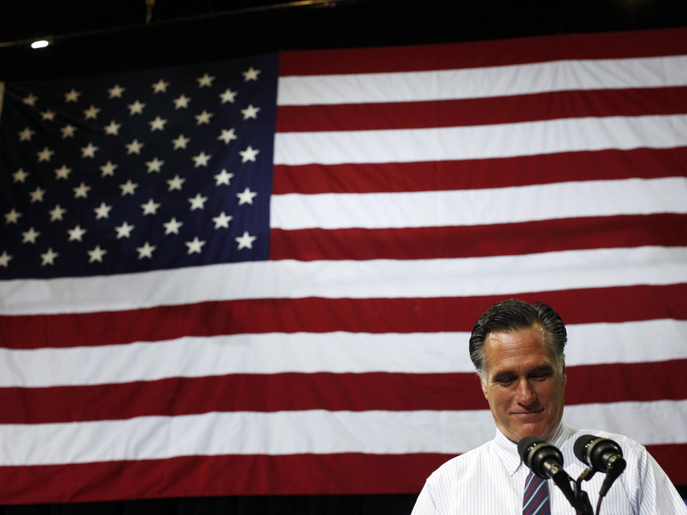 Republican presidential nominee Mitt Romney pauses while speaking at a campaign rally at the Patriot Center at George Mason University in Fairfax, Va., on Monday.