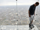 Zac Vawter, fitted with an experimental "bionic" leg, looks down from the Ledge at the Willis Tower, on Thursday in Chicago. Zac Vawter, fitted with an experimental "bionic" leg, looks down from the Ledge at the Willis Tower, on Thursday in Chicago.