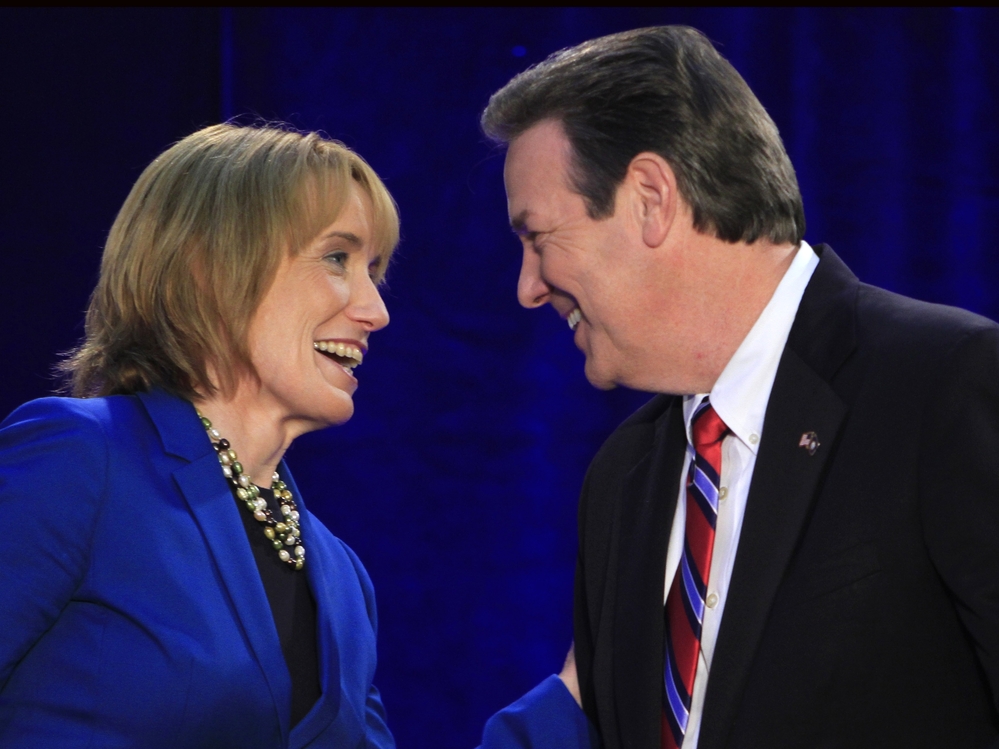 New Hampshire gubernatorial candidates Democrat Maggie Hassan and Republican Ovide Lamontagne talk before their Oct. 4 debate in Henniker, N.H.