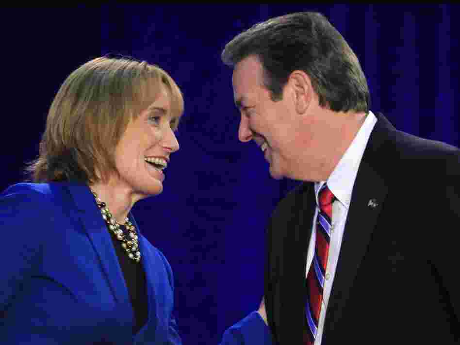 New Hampshire gubernatorial candidates Democrat Maggie Hassan and Republican Ovide Lamontagne talk before their Oct. 4 debate in Henniker, N.H.