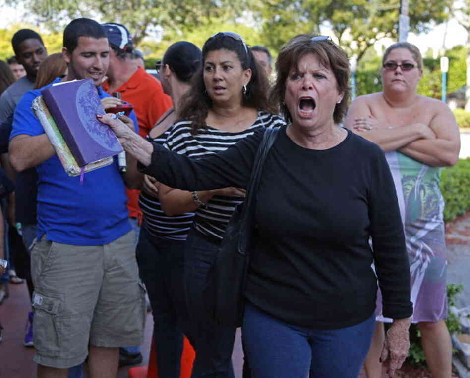 Kendall, Florida, resident, Diane, right, demands access to early voting. Hundreds stood in line at the Miami-Dade Elections Department to vote early.