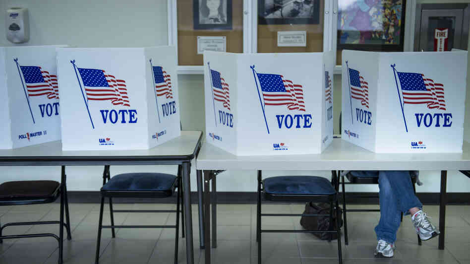 A citizen votes on a paper ballot during the final day of early voting Monday in Lancaster, Ohio.