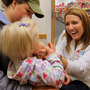 Nurse practitioner Leah Martin examines 13-month-old Mia Beavers at a CVS clinic in Chagrin Falls, Ohio, in early 2009. Mia's mother, Brittany, looks on.