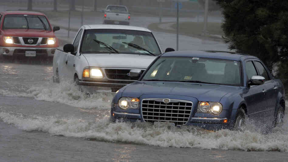 Motorists drive through standing water at an intersection flooded from the remnants of Tropical Storm Ida in the Ocean View area of Norfolk, Va., in November 2009. Motorists drive through standing water at an intersection flooded from the remnants of Tropical Storm Ida in the Ocean View area of Norfolk, Va., in November 2009.