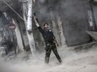 A rebel fighter raises his weapon after firing a missile Sunday toward Syrian government troops in the northern city of Aleppo. Syria's largest city has been the scene of heavy fighting for the past three months. Both sides control part of the city, and the fight has been a stalemate recently. A rebel fighter raises his weapon after firing a missile Sunday toward Syrian government troops in the northern city of Aleppo. Syria's largest city has been the scene of heavy fighting for the past three months. Both sides control part of the city, and the fight has been a stalemate recently.