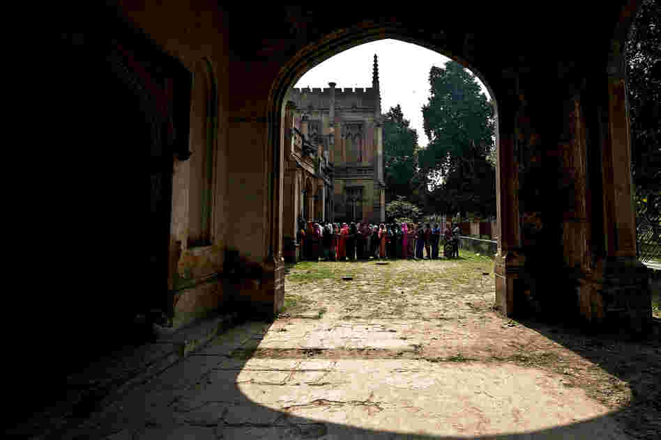 Women stand in line to vote during state elections in Varanasi, India, 2012.