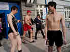 In Russia, winter swimming enthusiasts leave a polling station where they cast their presidential vote shortly after taking a bath in the icy waters of the Siberian city of Novosibirsk, on March 4, 2012.