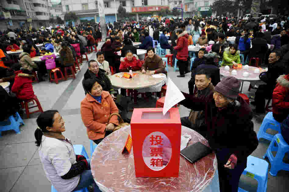 Villagers submit forms during a poll in Sichuan Province, China, 2009.