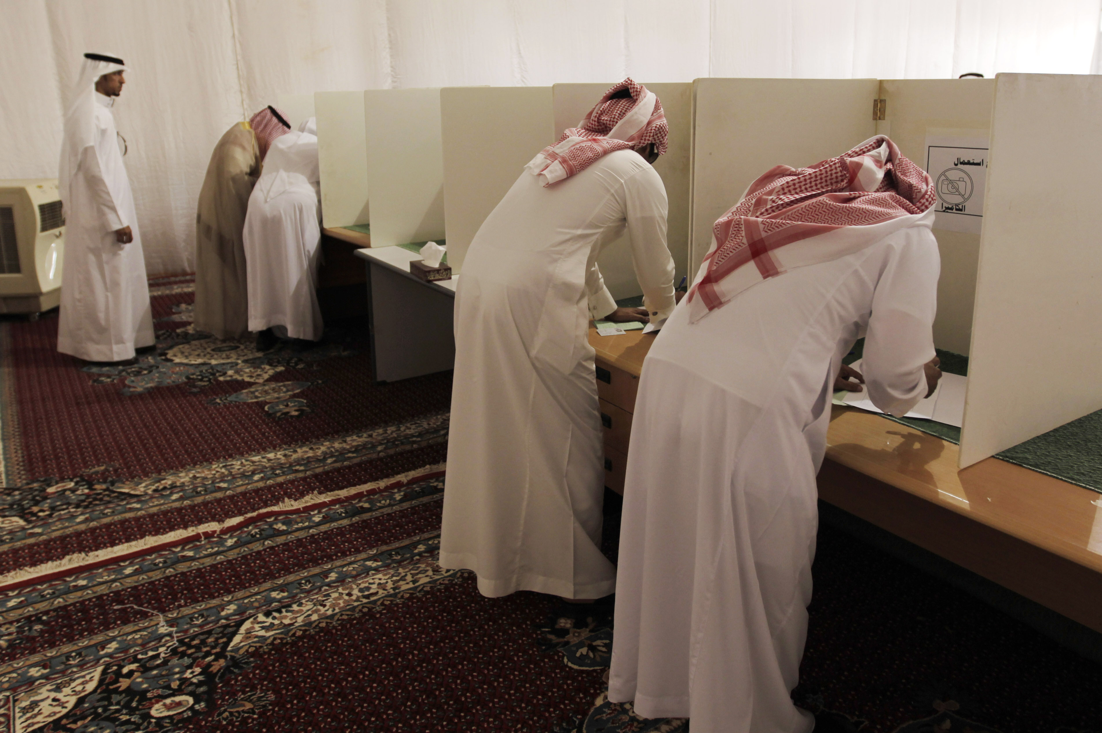 Voters cast ballots in municipal elections in Saudi Arabia. In 2011, King Abdullah of Saudi Arabia granted women the right to vote and run in municipal elections — but not until 2015.