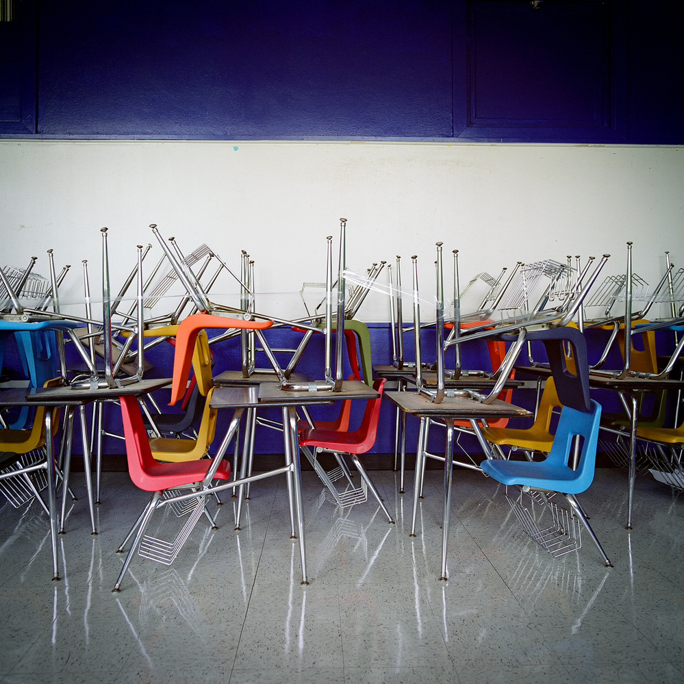 School desks are piled on top of each other at H.S. Thompson Elementary School in Dallas. Thompson was one of 11 schools closed by DISD in 2012.