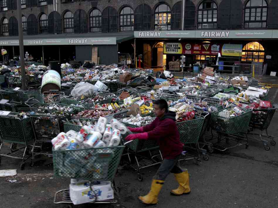 Shopping carts full of food damaged by Sandy await disposal at Fairway. Shopping carts full of food damaged by Sandy await disposal at Fairway.