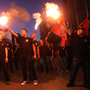 Members of the Greek ultranationalist Golden Dawn Party, sing the national anthem outside the party's office in Thessaloniki in June. The party's support has been boosted by anti-immigrant anger. Members of the Greek ultranationalist Golden Dawn Party, sing the national anthem outside the party's office in Thessaloniki in June. The party's support has been boosted by anti-immigrant anger.