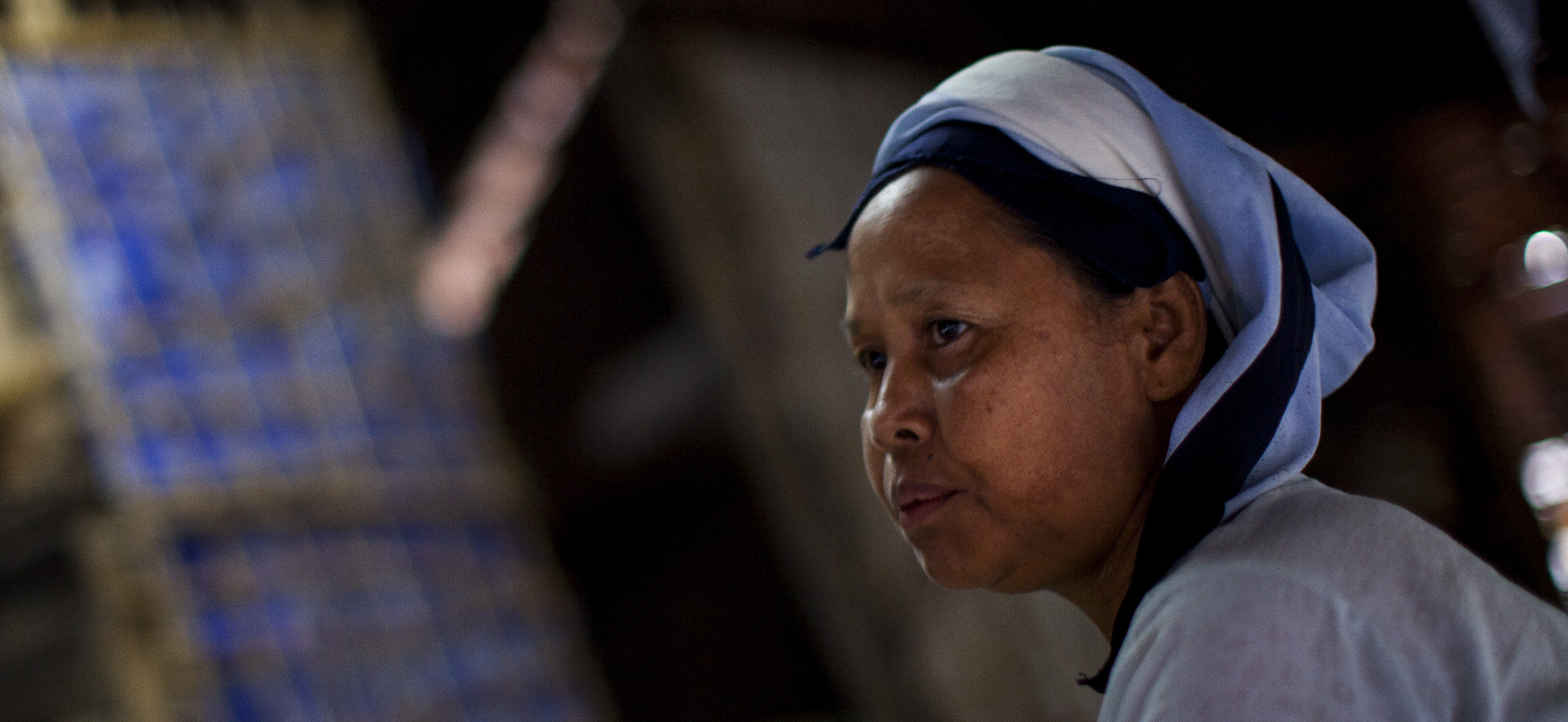 Daw Khin Twon, an undocumented immigrant from Burma, rests at home after receiving malaria treatment at the Mae Tao Clinic in Mae Sot, Thailand.