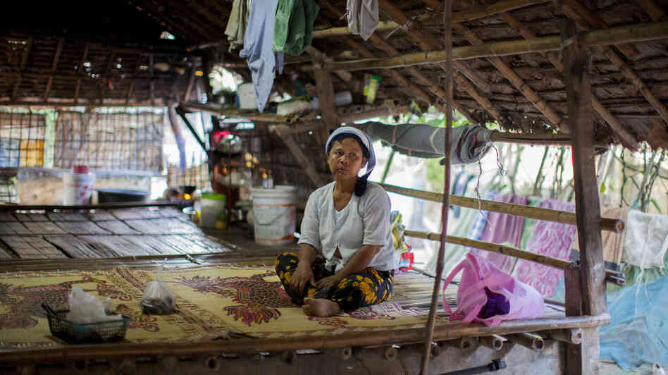 Daw Khin Twon, an undocumented immigrant from Burma, rests at home after receiving malaria treatment at the Mae Tao Clinic in Mae Sot, Thailand.
