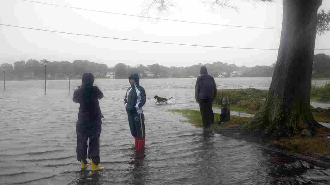 Residents of the Colonial Place neighborhood watch as heavy rain from Hurricane Sandy floods the Lafayette River in Norfolk, Va., on Oct. 28. Residents of the Colonial Place neighborhood watch as heavy rain from Hurricane Sandy floods the Lafayette River in Norfolk, Va., on Oct. 28.