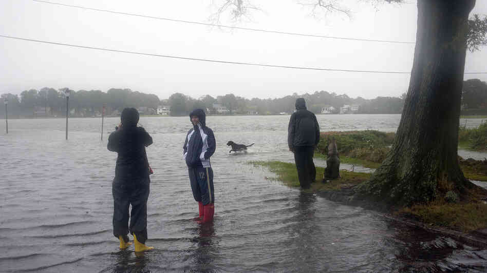 Residents of the Colonial Place neighborhood watch as heavy rain from Hurricane Sandy floods the Lafayette River in Norfolk, Va., on Oct. 28. Residents of the Colonial Place neighborhood watch as heavy rain from Hurricane Sandy floods the Lafayette River in Norfolk, Va., on Oct. 28.