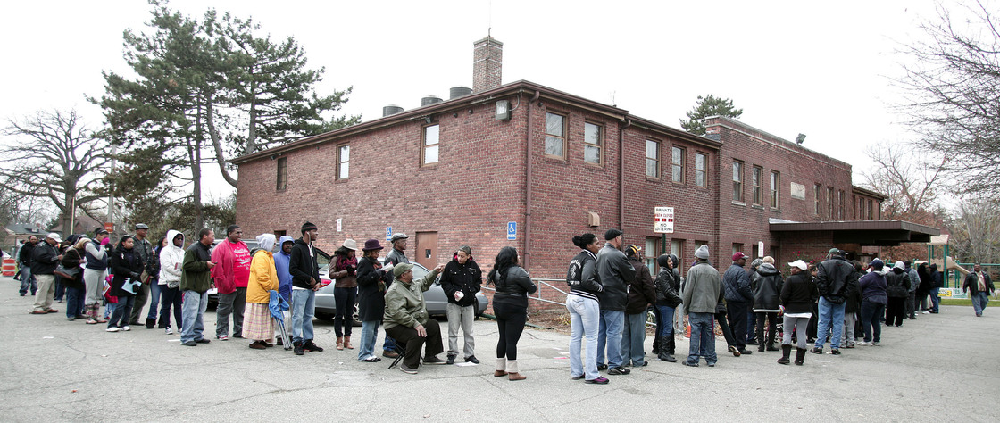 African-American turnout and enthusiasm for Obama are matching levels seen four years ago. Above, voters wait in a long line in Detroit, Mich., on Tuesday.