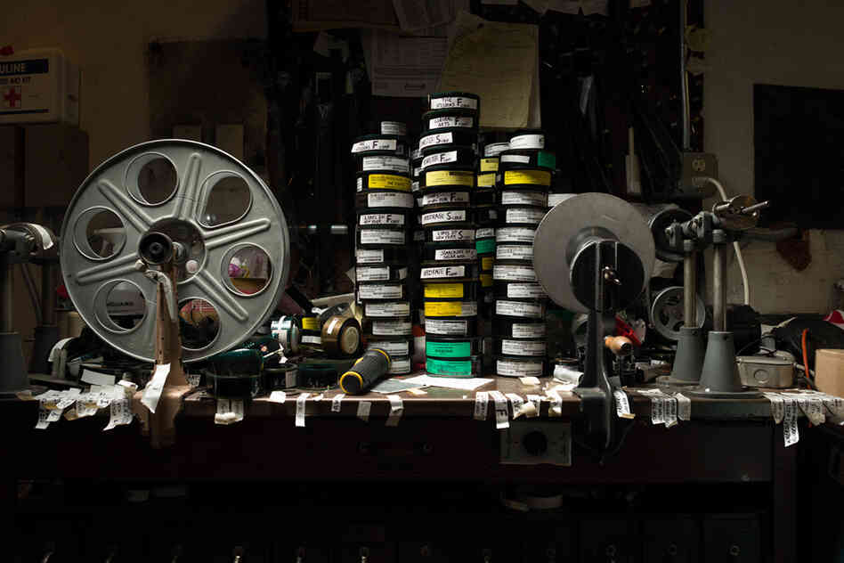Editing table at the Avon Theater, Stamford, Conn. The table is currently stacked with trailers, or, as they're now known, previews.