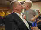 Sen. Jon Tester, D-Mont., receives a kiss from his grandson Wednesday in Great Falls, Mont. Tester won re-election in a tight contest with Republican Rep. Denny Rehberg.