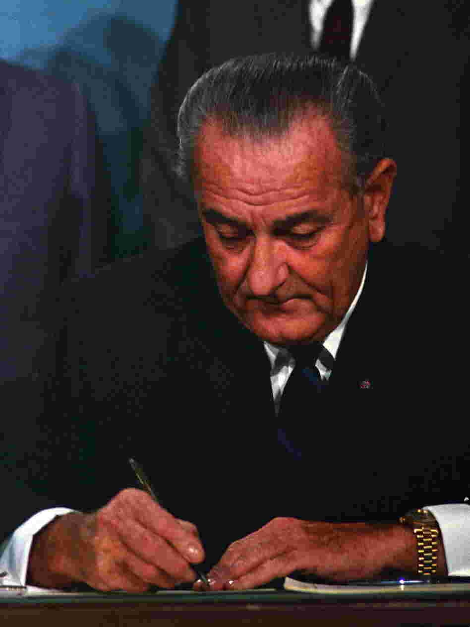 President Lyndon B. Johnson signs the Public Broadcasting Act of 1967