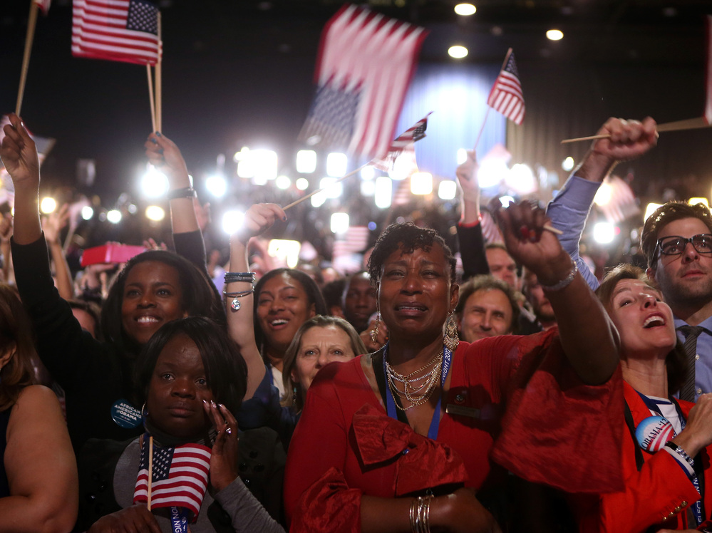 Supporters cheer as President Obama delivers his victory speech in Chicago.