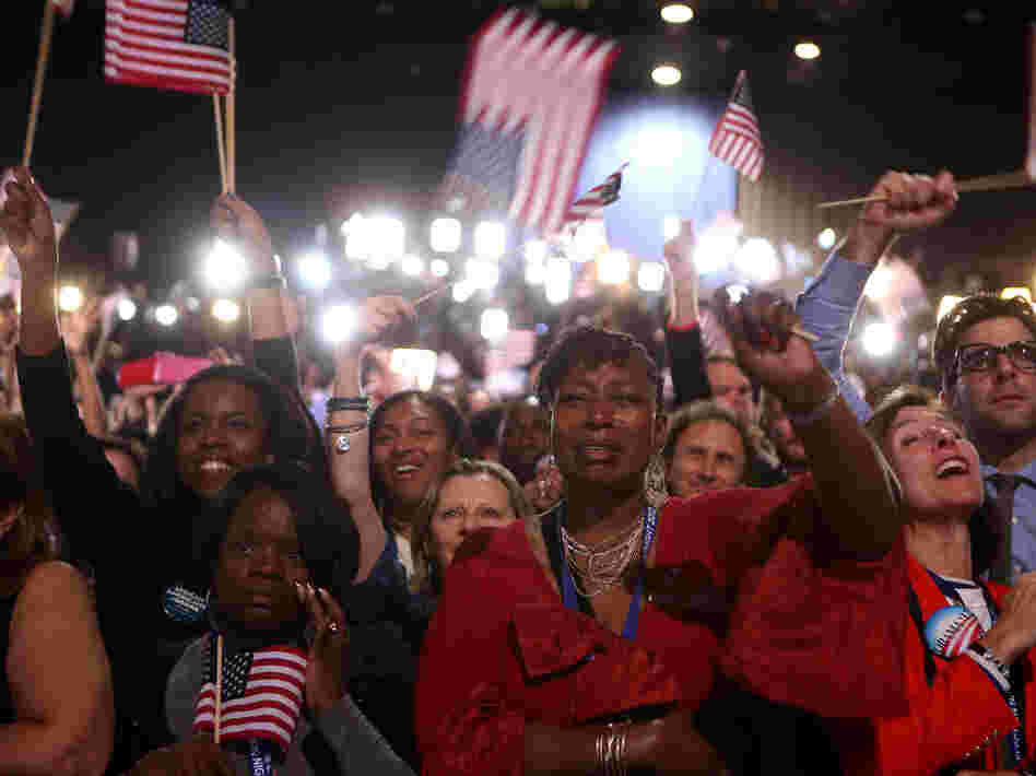 Supporters cheer as President Obama delivers his victory speech in Chicago.
