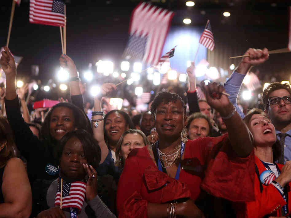 Supporters cheer as President Obama delivers his victory speech in Chicago.