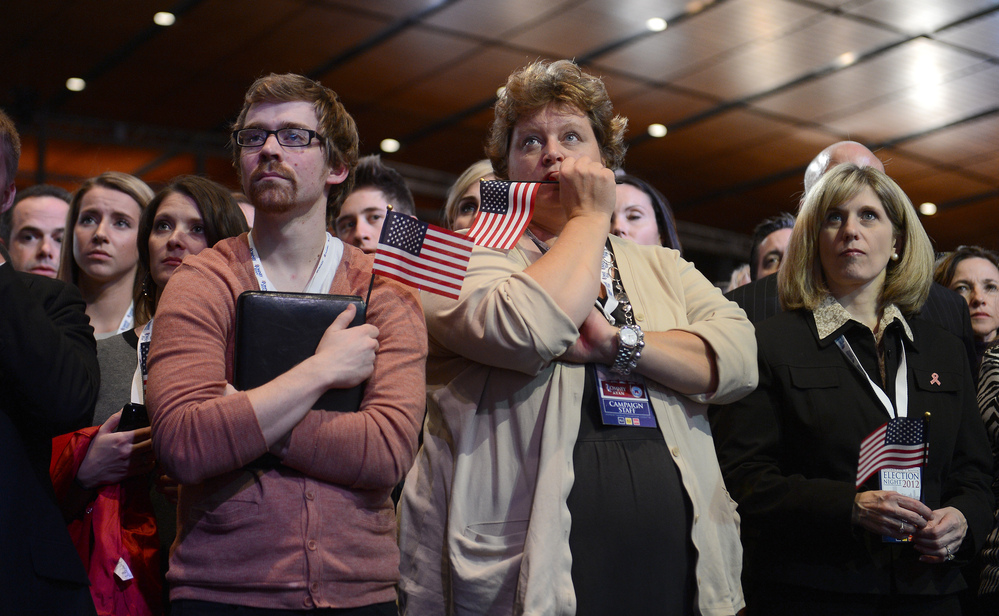 Supporters of Republican presidential candidate Mitt Romney react to his defeat in Boston.