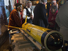 John Disney (second from left) looks over the underwater probe used in his company's ocean fertilization project, at a news conference in Vancouver, British Columbia, in October. John Disney (second from left) looks over the underwater probe used in his company's ocean fertilization project, at a news conference in Vancouver, British Columbia, in October.