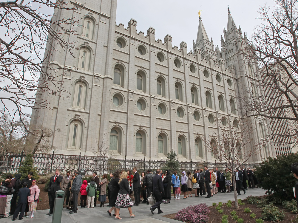 Mormons line up outside the historic Salt Lake Temple for an annual conference in April 2010.