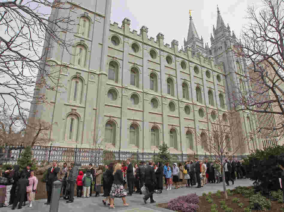 Mormons line up outside the historic Salt Lake Temple for an annual conference in April 2010.