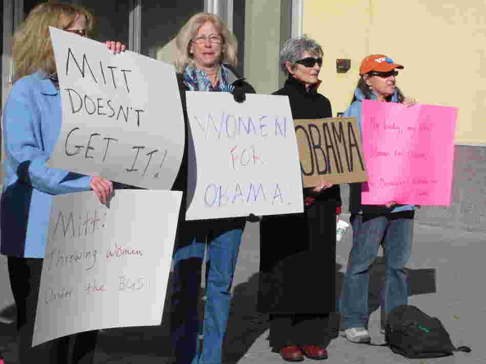 On Oct. 24, women backing President Obama protest outside a convention center in Reno, Nev., where Republican Mitt Romney was giving a campaign speech. Exit polls show significant support from women was a key factor in Obama's victory over Romney in Nevada.