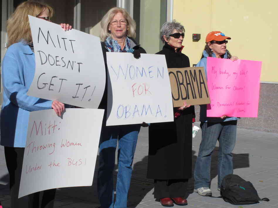 On Oct. 24, women backing President Obama protest outside a convention center in Reno, Nev., where Republican Mitt Romney was giving a campaign speech. Exit polls show significant support from women was a key factor in Obama's victory over Romney in Nevada.