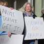 On Oct. 24, women backing President Obama protest outside a convention center in Reno, Nev., where Republican Mitt Romney was giving a campaign speech. Exit polls show significant support from women was a key factor in Obama's victory over Romney in Nevada.