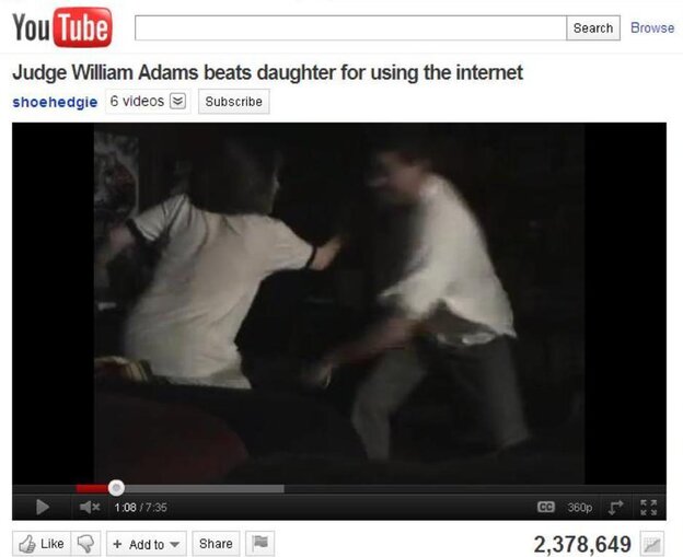 Hillary Adams (left) as her father was striking her with a belt. She set up a video camera to record what she says was one of many such beatings.