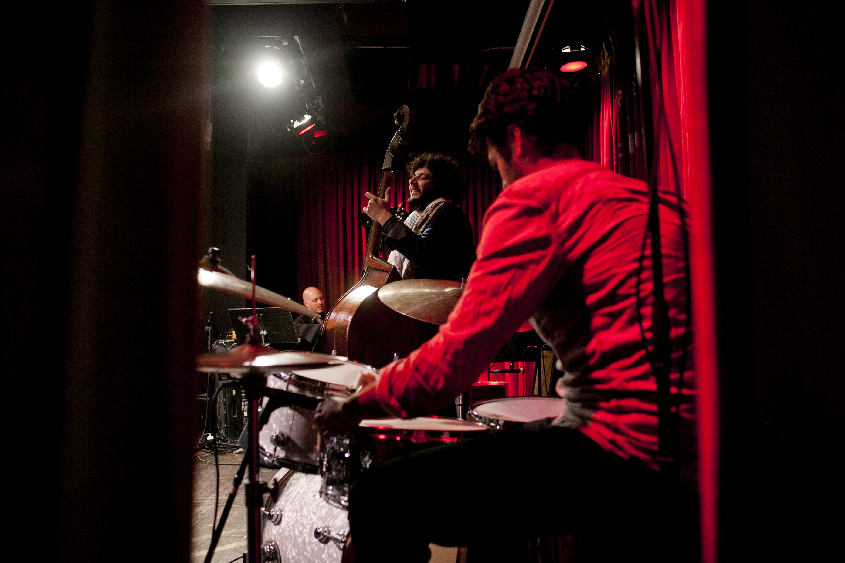 Omer Avital, framed by his drummer Daniel Freedman.