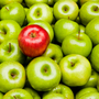 Red apple among green ones Red apple among green ones
