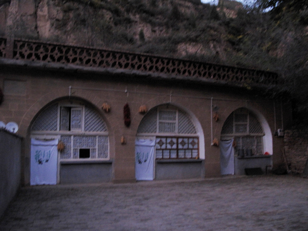 Xi lived in the cave house on the far right, in Liangjiahe village in central China. After his father's political downfall in Beijing, his parents sent him there when he was 15 in 1968.