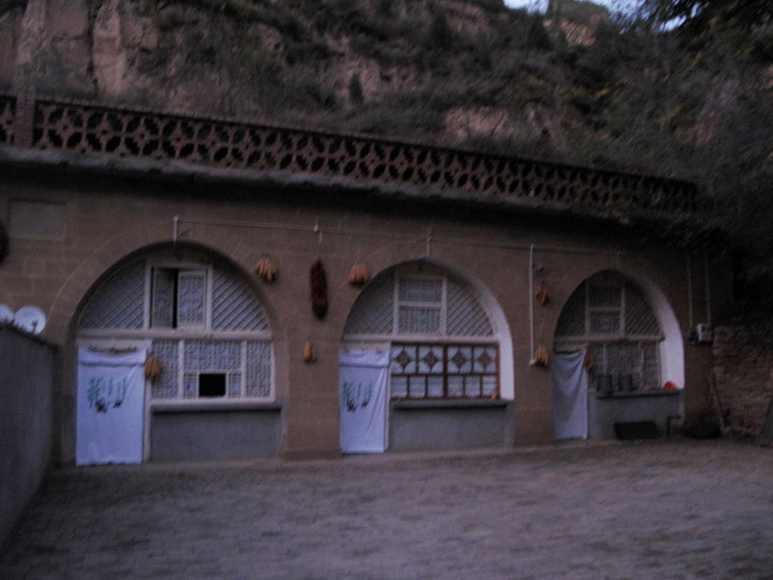 Xi lived in the cave house on the far right, in Liangjiahe village in central China. After his father's political downfall in Beijing, his parents sent him there when he was 15 in 1968.