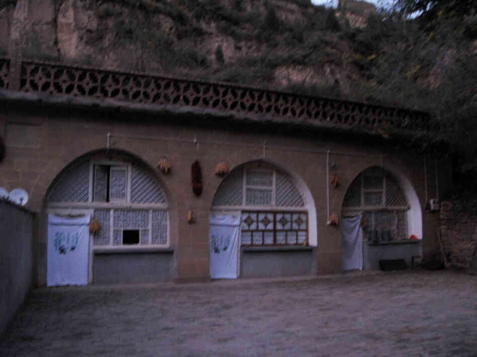 Xi lived in the cave house on the far right, in Liangjiahe village in central China. After his father's political downfall in Beijing, his parents sent him there when he was 15 in 1968.