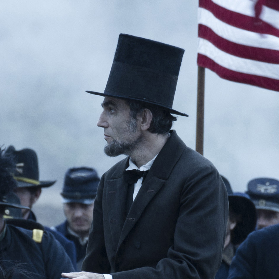 President Abraham Lincoln (Daniel Day-Lewis) looks across a battlefield in the aftermath of a terrible siege in Lincoln.