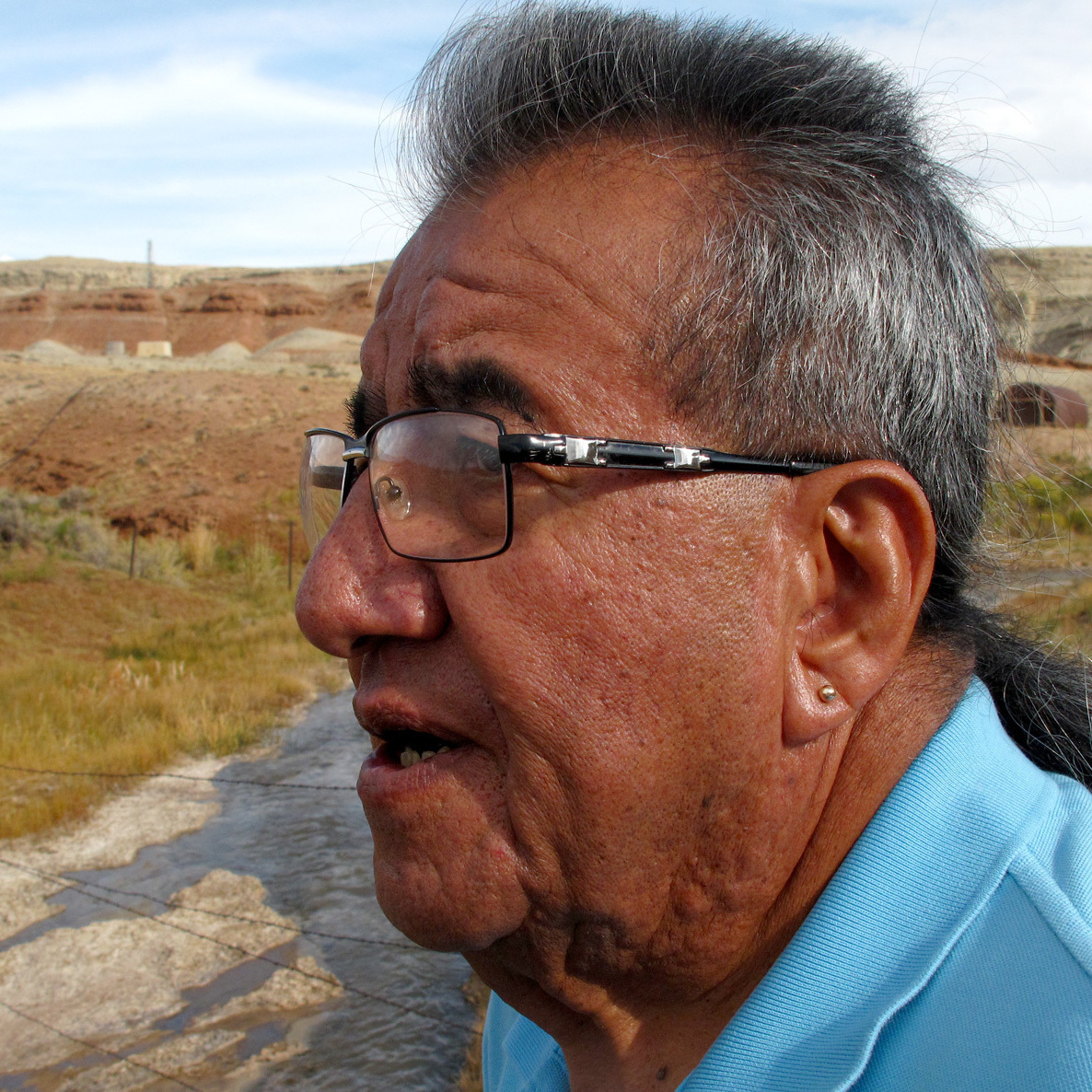 Wes Martel, vice chairman for the Eastern Shoshone Business Council, stands near a murky gray stream full of oil field wastewater. He's concerned about the effects the wastewater has on wildlife, water quality and, since cows drink it, he wonders: "What's in your steak?"