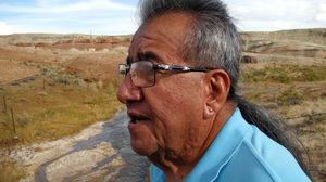 Wes Martel, vice chairman for the Eastern Shoshone Business Council, stands near a murky gray stream full of oil field wastewater. He's concerned about the effects the wastewater has on wildlife, water quality and, since cows drink it, he wonders: "What's in your steak?"