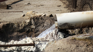 Internal EPA documents released to NPR show some EPA staffers have been trying to figure out what is in the wastewater released by oil companies. There are lots of chemicals. Some leave solid residues like these white and gray mounds. Danger signs near this outflow pipe warn that poisonous gas fumes from the water can cause respiratory irritation or suffocation.