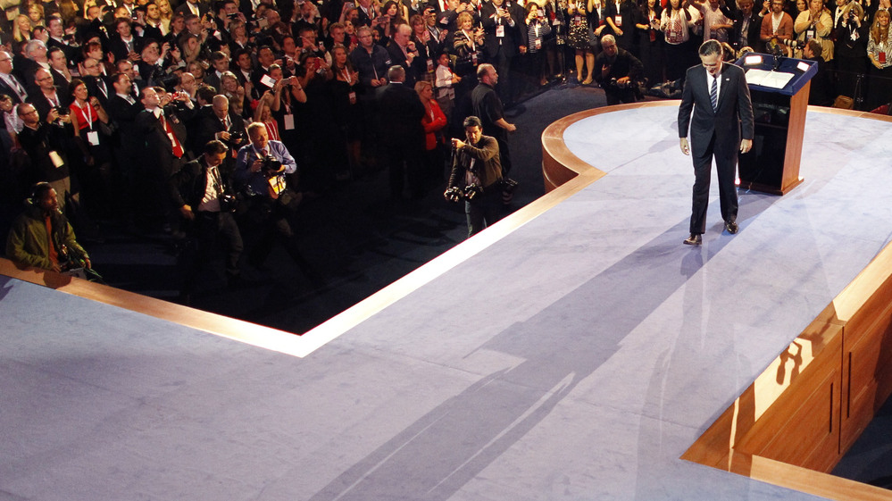 Republican presidential candidate and former Massachusetts Gov. Mitt Romney leaves the podium after conceding the presidency in Boston.