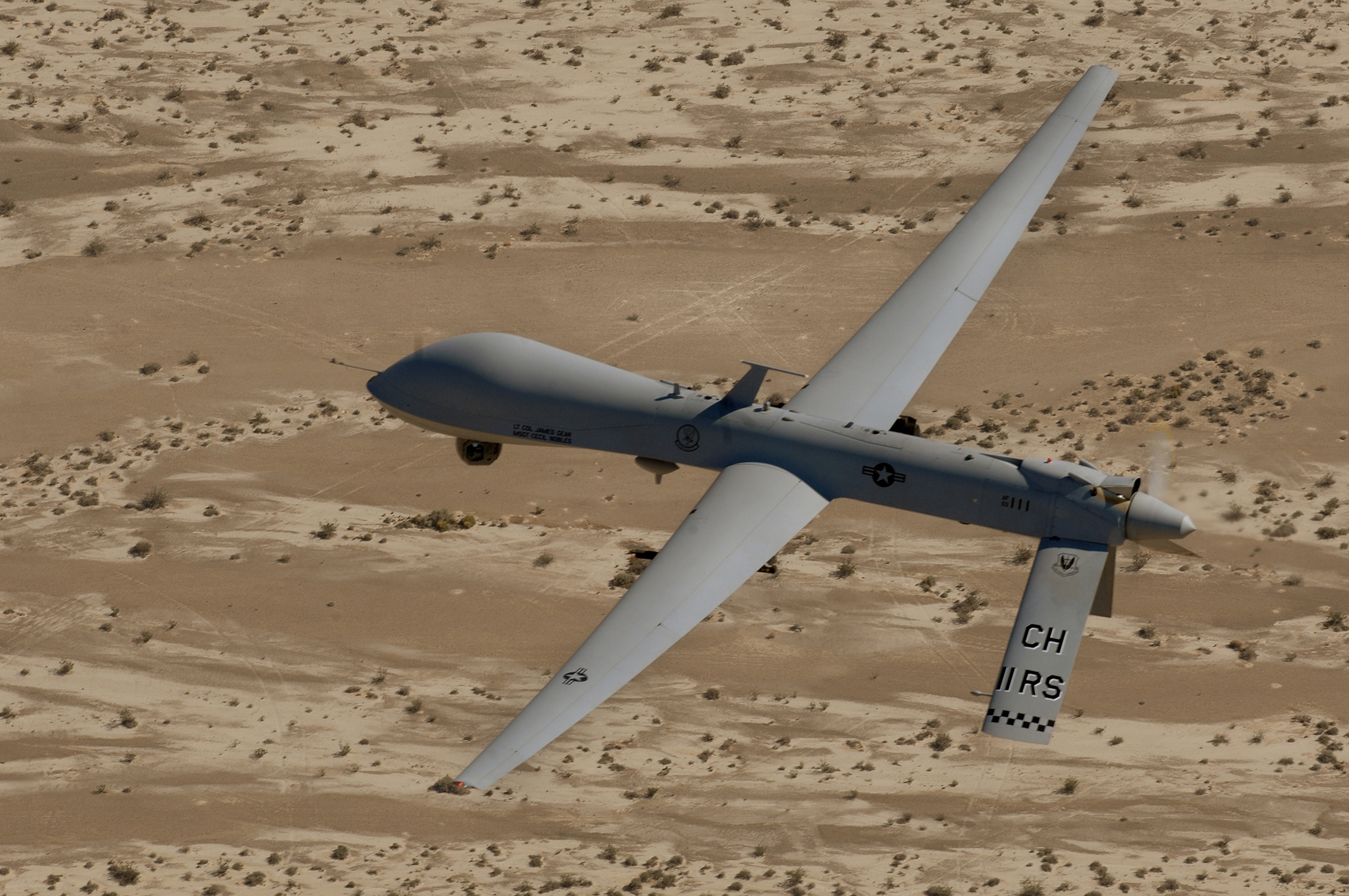 In this Sept. 6, 2007 photo, an MQ-1 Predator unmanned aerial vehicle flies over a range in Nevada. In this Sept. 6, 2007 photo, an MQ-1 Predator unmanned aerial vehicle flies over a range in Nevada.